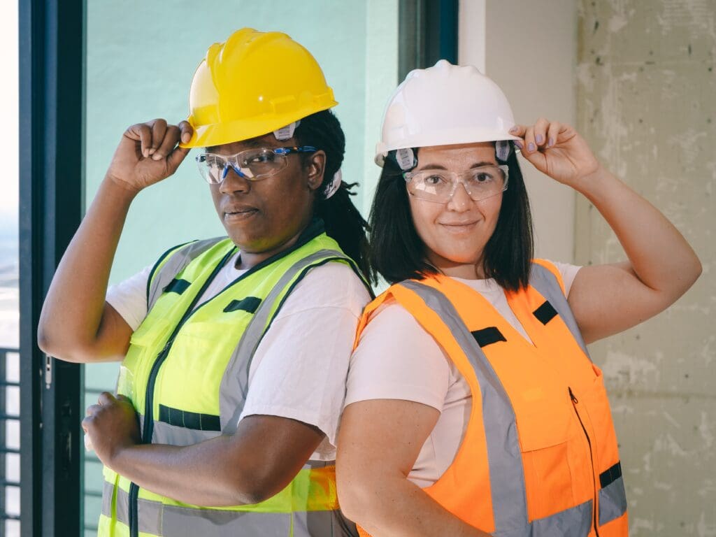 Two women in safety vests and hard hats